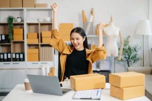 image of a business woman excited about the customers she is connecting with online